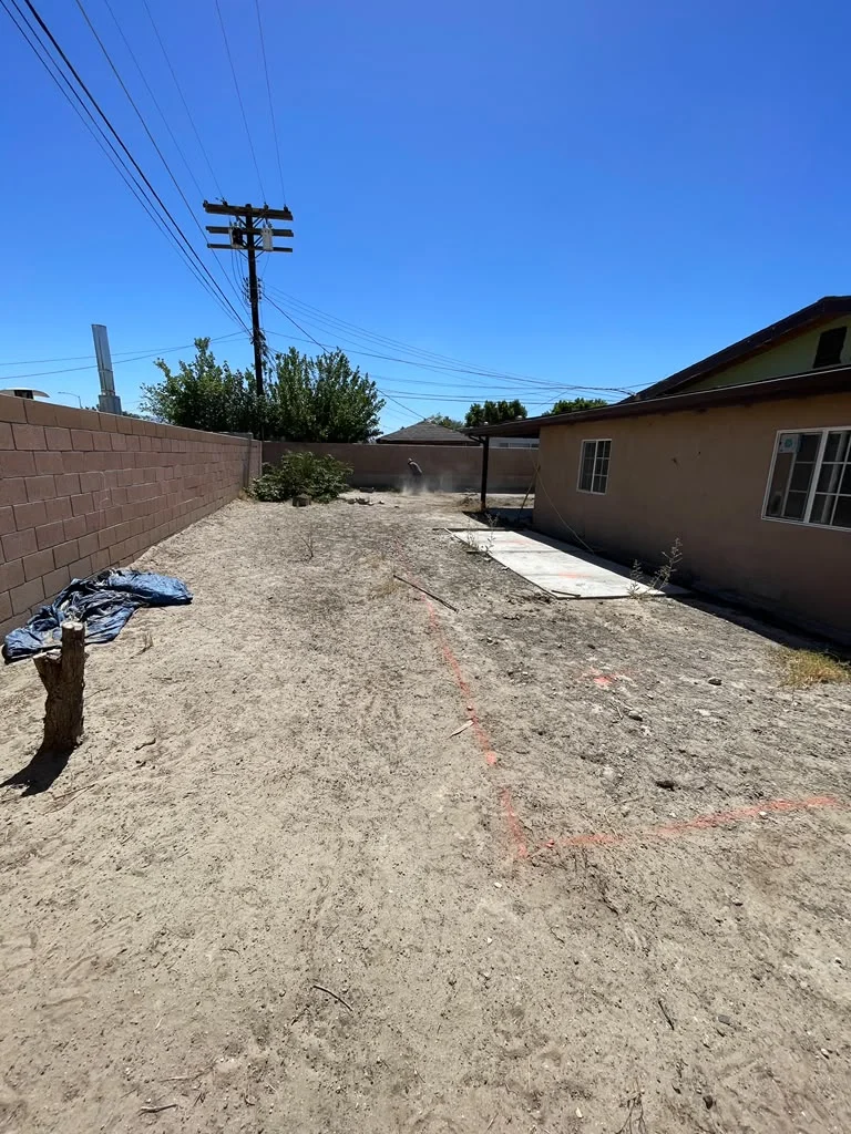 Outdoor area before turf and paver installation in Indio, CA — photo 1