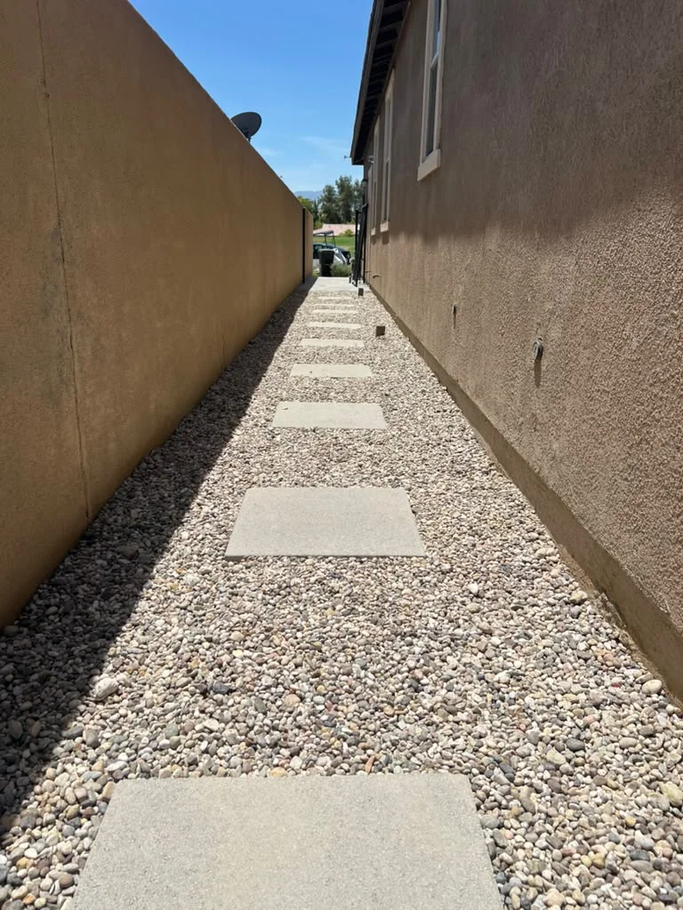 New stepping stones and decorative gravel in Indio backyard — photo 3